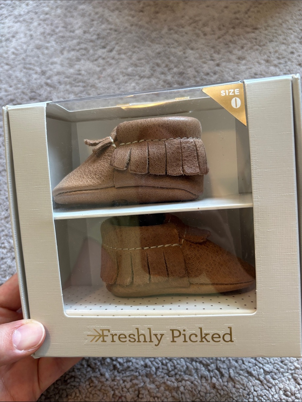 Freshly picked newborn weathered brown moccasins